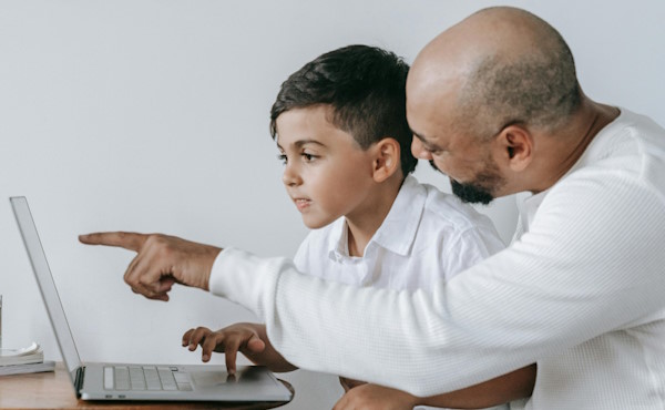Parent and child looking at content on a website